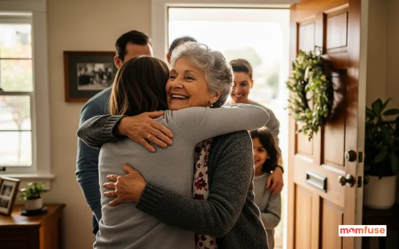 happy senior woman welcoming family at front door, warm hug reunion moment.