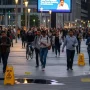 Busy public space with people walking, subtle hazard signs, diverse crowd, safety emphasis, realistic lighting.