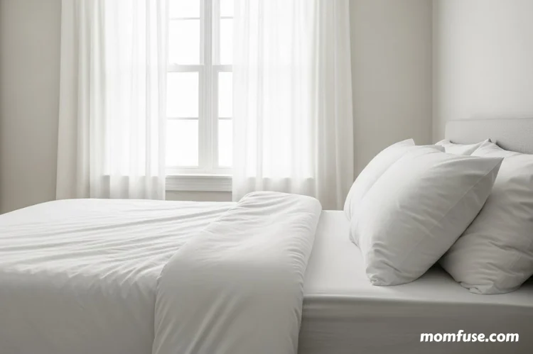 Pet-free bedroom with closed door, clean white bedding, allergen-proof pillow covers.