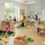 happy children playing in a bright, safe childcare center with caring teachers.