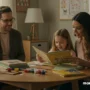 A warm, inviting homeschooling scene: a parent and child sitting at a cozy table with books.