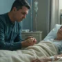 A balanced composition showing a hospital bed with a patient’s hand being held by a family member.