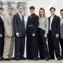 diverse group of young people with androgynous appearance standing together, modern fashion.