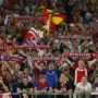 A vibrant crowd cheering at a sports event.