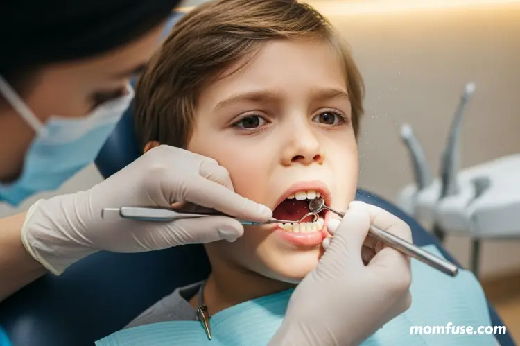 Child receiving a dental cleaning, close-up of dentist removing plaque.
