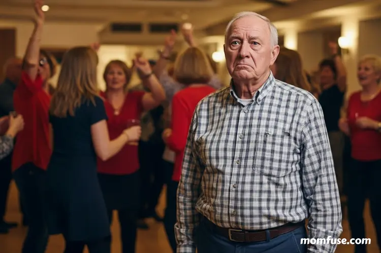 An older adult standing apart from a lively group at a social gathering look in confused.